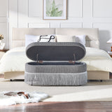 Oval Upholstered Storage Ottoman With Fringe Trim & Lift Top Lid