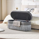 Oval Upholstered Storage Ottoman With Fringe Trim & Lift Top Lid