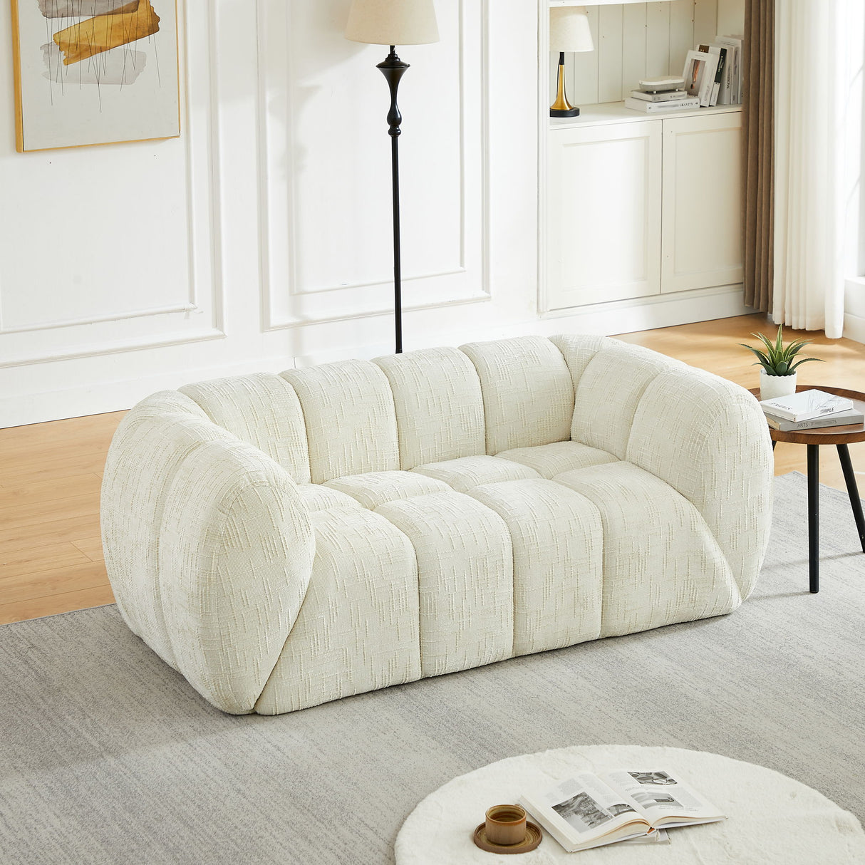 Quilted Cloud Sofa With Rounded Armrests And Piano Key Backrest Design