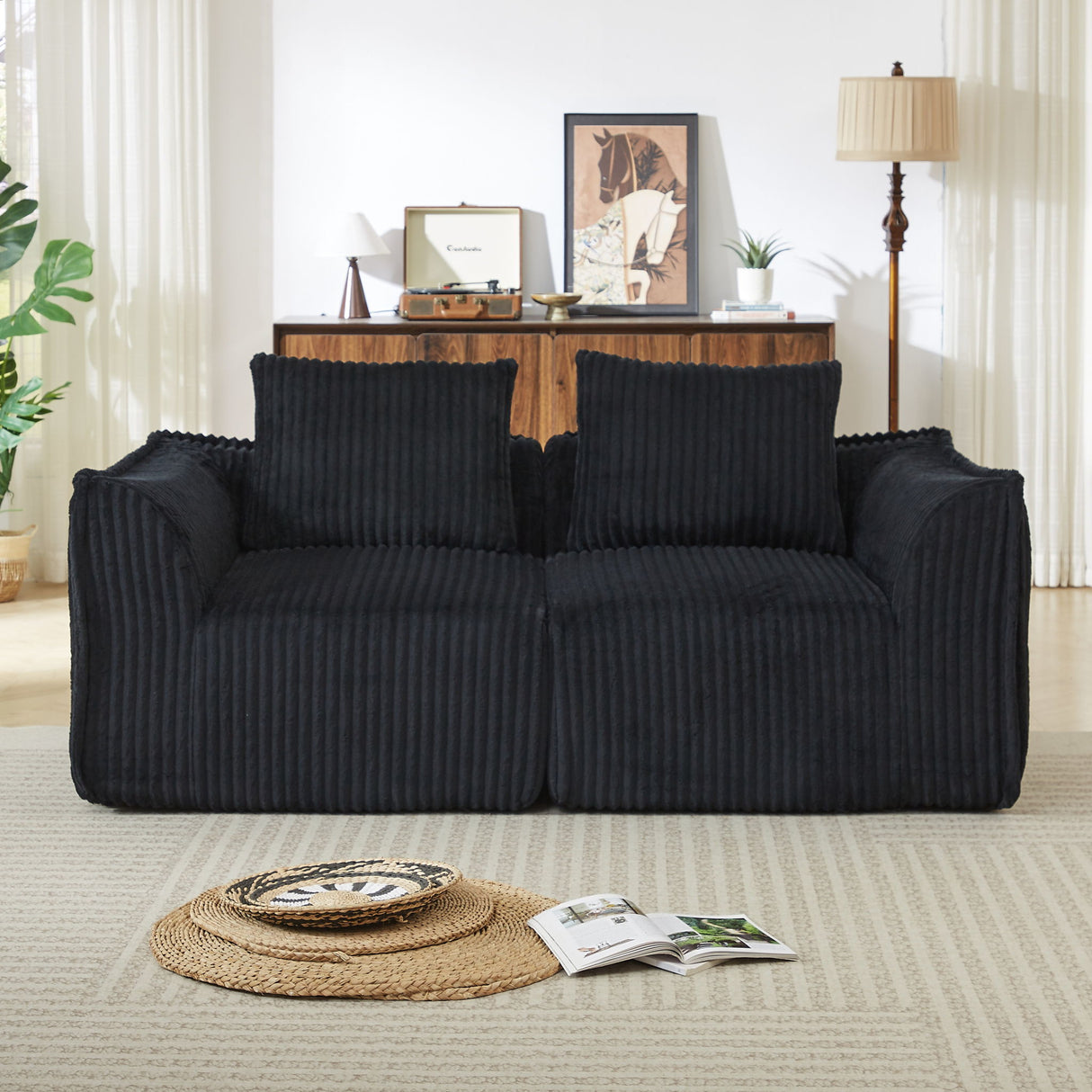 Minimalist Sofa With Curved Lines And Horn Shaped Throw Pillows