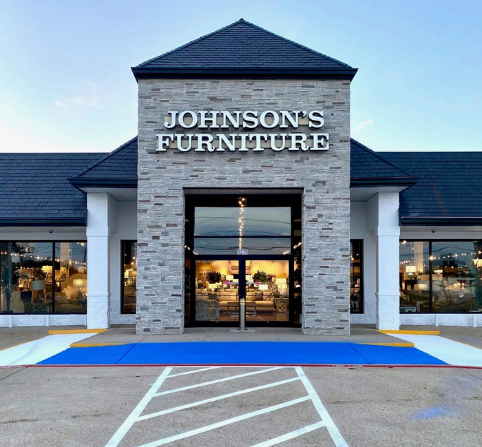 Johnson's Furniture store front with a clear sky background
